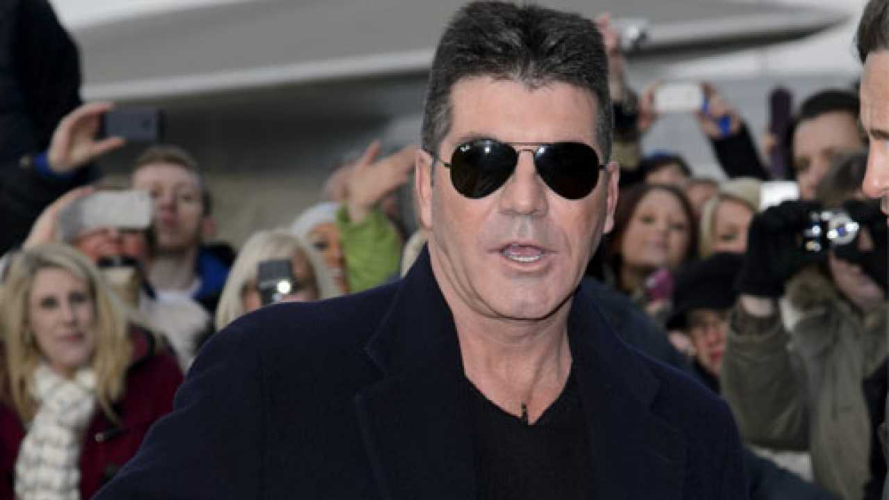 Simon Cowell reluctant to 'commit' to pregnant gal-pal Lauren Silverman