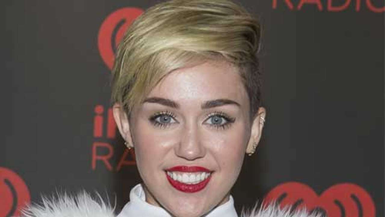 Miley Cyrus shocks in penis bodysuit for UK mag shoot