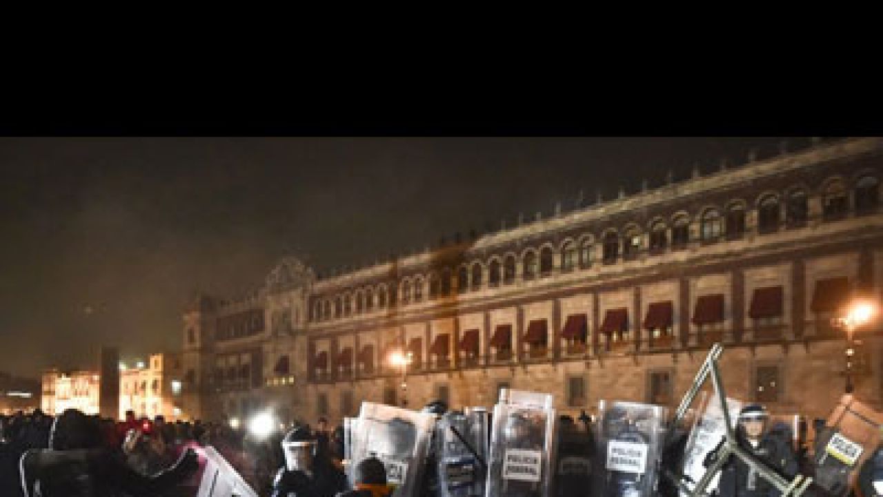 Molotov cocktails, clashes as thousands of Mexicans protest over massacre