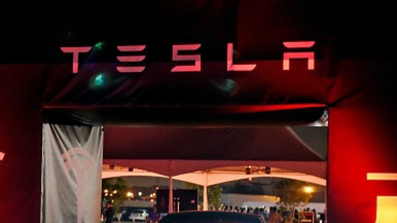 Tesla to work on automatic charging system that slithers to cars like 'solid metal snake'