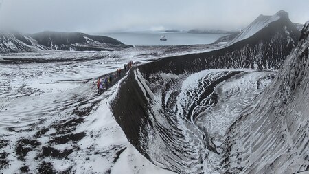 Caldera of the volacano on Deception island and our ship seen in distance. Image Credit: Ankit Taparia