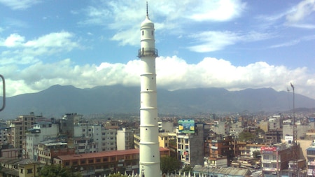 Dharahara, also called Bhimsen Tower, was a nine storey 61.88 metres tall tower at the center of Sundhara in Kathmandu.