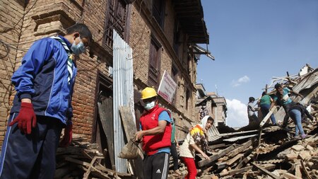 Nepal Scout volunteering in Sakhu village to salvage whatever is left from the damaged houses. Image Credit: Sarika Gulati