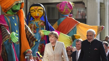 German Chancellor Angela Merkel (L) and Indian Prime Minister Narendra Modi (R) attend the official opening of the Hannover Messe industrial trade fair in Hanover, central Germany on April 12, 2015.