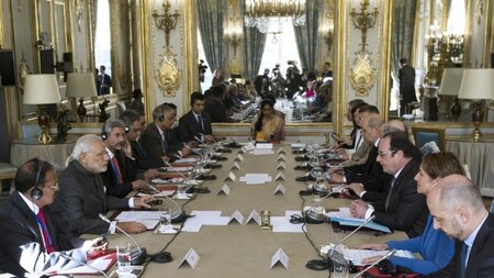 French president Francois Hollande (3rd R) meets with Indian Prime Minister Narendra Modi (2nd L) at the Elysee Palace in Paris on April 10, 2015.