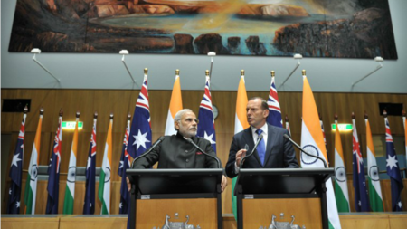 Indian Prime Minister Narendra Modi (L) speaks during a press conference with Australian Prime Minister Tony Abbott at Parliament House in Canberra on November 18, 2014.