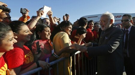 India's Prime Minister Narendra Modi greets onlookers after arriving at the Ottawa International Airport April 14, 2015.