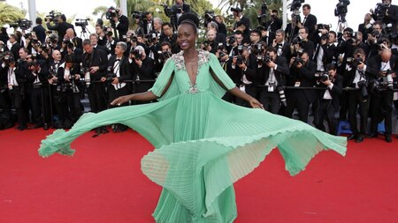 Lupita Nyongo twirled on red carpet in jade Gucci gown (AFP)