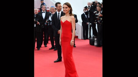 Natalie Portman opted for a red column gown from French design house Dior (AFP)