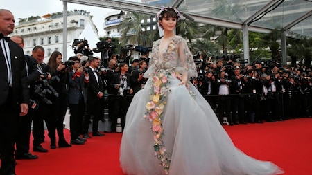 Continuing the flowery theme of her costumes, Chinese actress Fan Bingbing looks dainty in a flower crown and Marchesa gown! (Reuters)