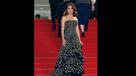 Cannes regular Selma Hayek looked gorgeous in a Black-gold bustier gown by Alexander McQueen (Reuters)