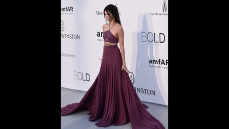 Current 'It Girl' of fashion world, Kendall Jenner went for a Calvin Klein gown in purple. She paired it with Chopard jewels. (Getty)