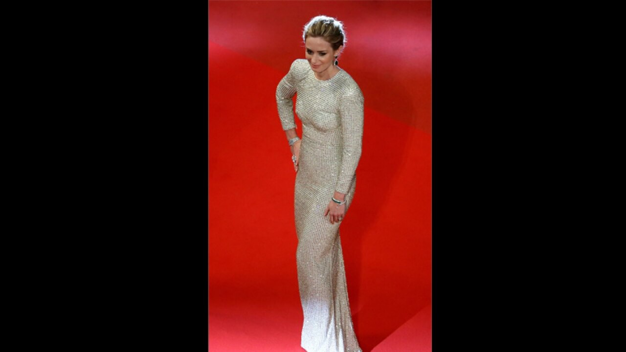Actress Emily blunt dazzled the red carpet in a white shimmery floor length Stella McCartney dress. Image Credit: Getty Images.