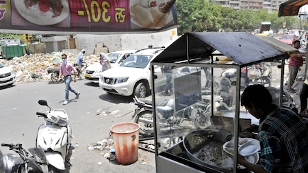 The main roads are littered with days of uncollected garbage