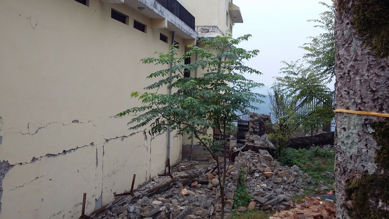 The collapsed outer wall of Chautara jail in Nepal from where prisoners escaped