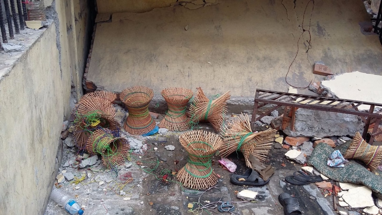 Unfinished cane stools now soaked in rain and covered in dust