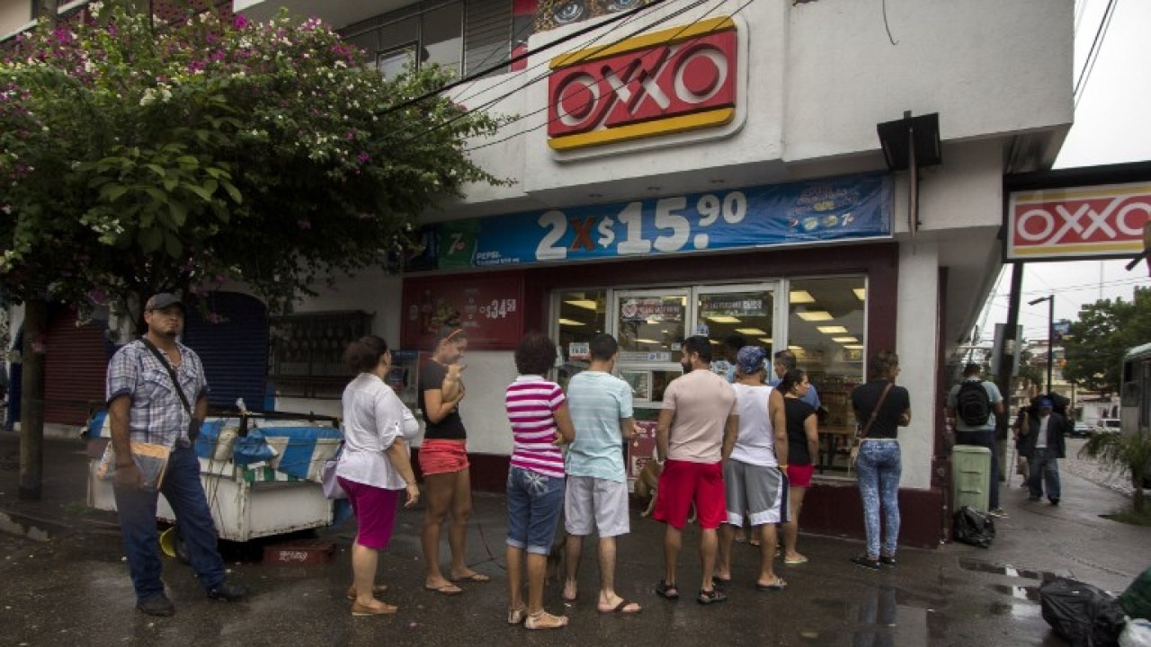 People line up to buy food and water before the arrival of hurricane Patricia in Puerto Vallarta, Mexico