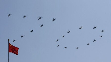Chinese military helicopters form the number '70' in the sky