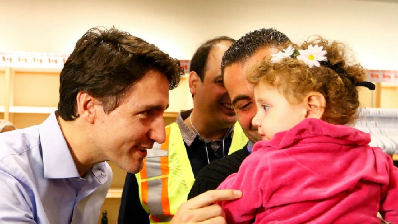 Watch: Canada's PM Justin Trudeau greets first plane of Syrian refugees