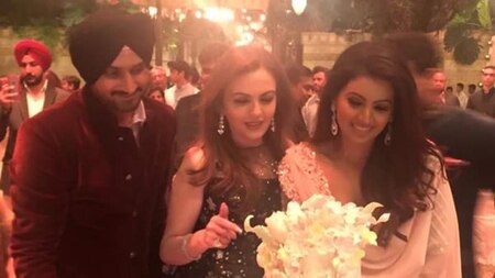 Nita Ambani with the newlyweds Harbhajan Singh and Geeta Basra