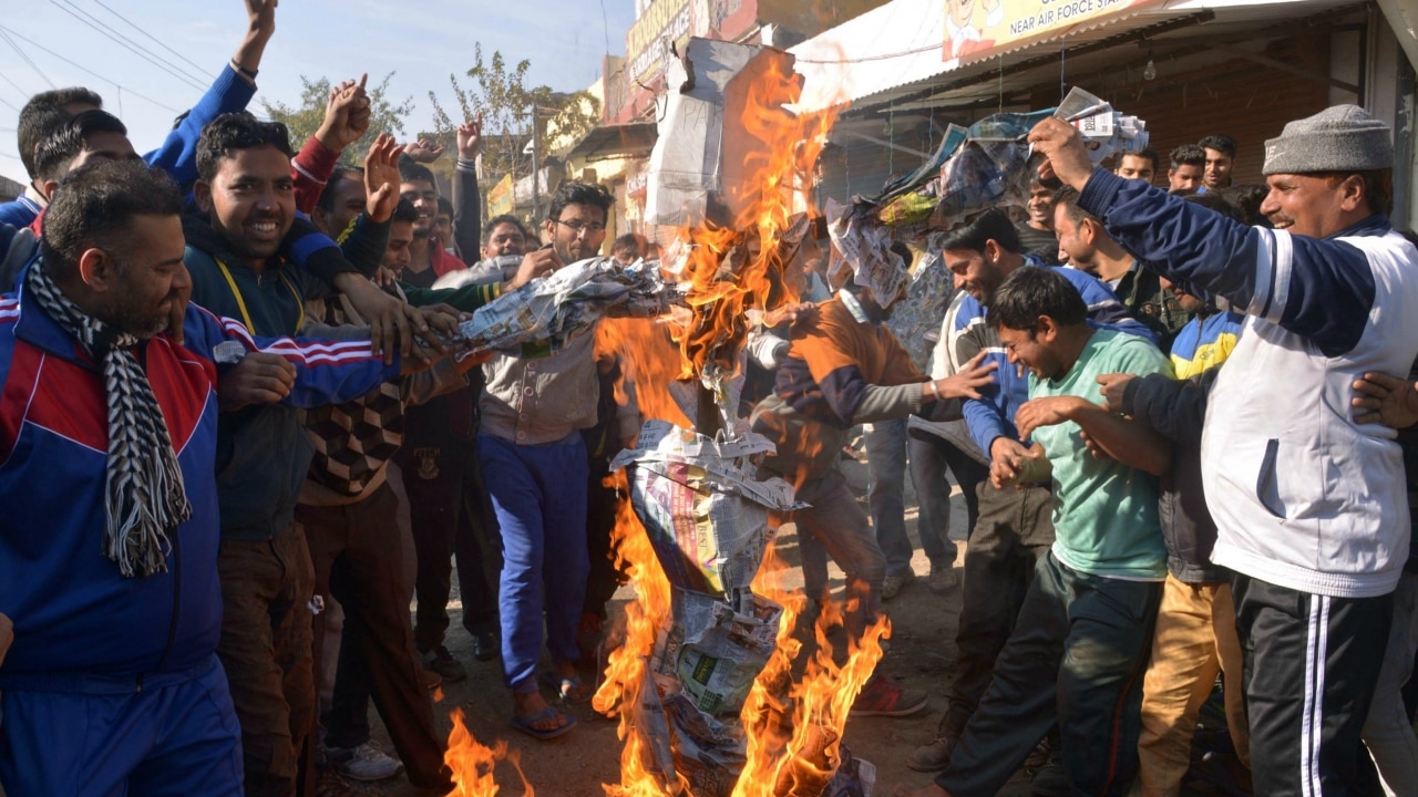 Setting fire to an effigy during the attacks