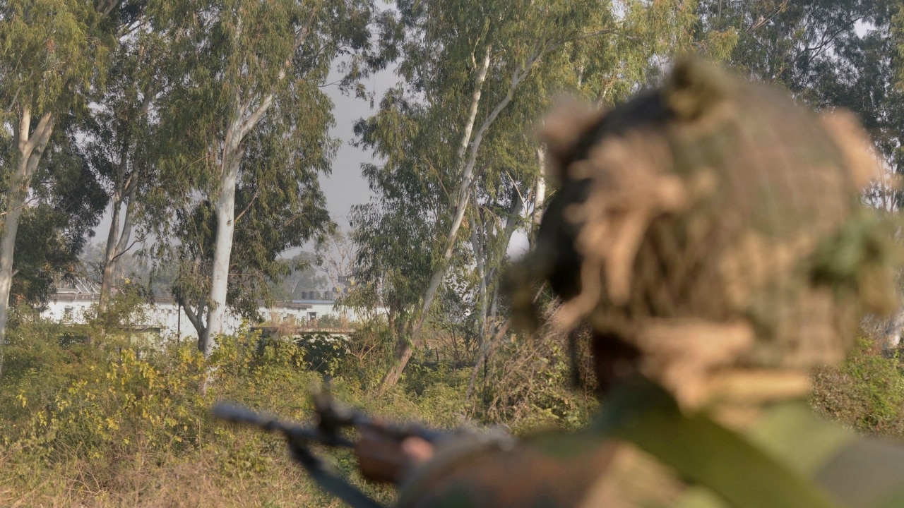 A Soldier takes up his position on the perimeter