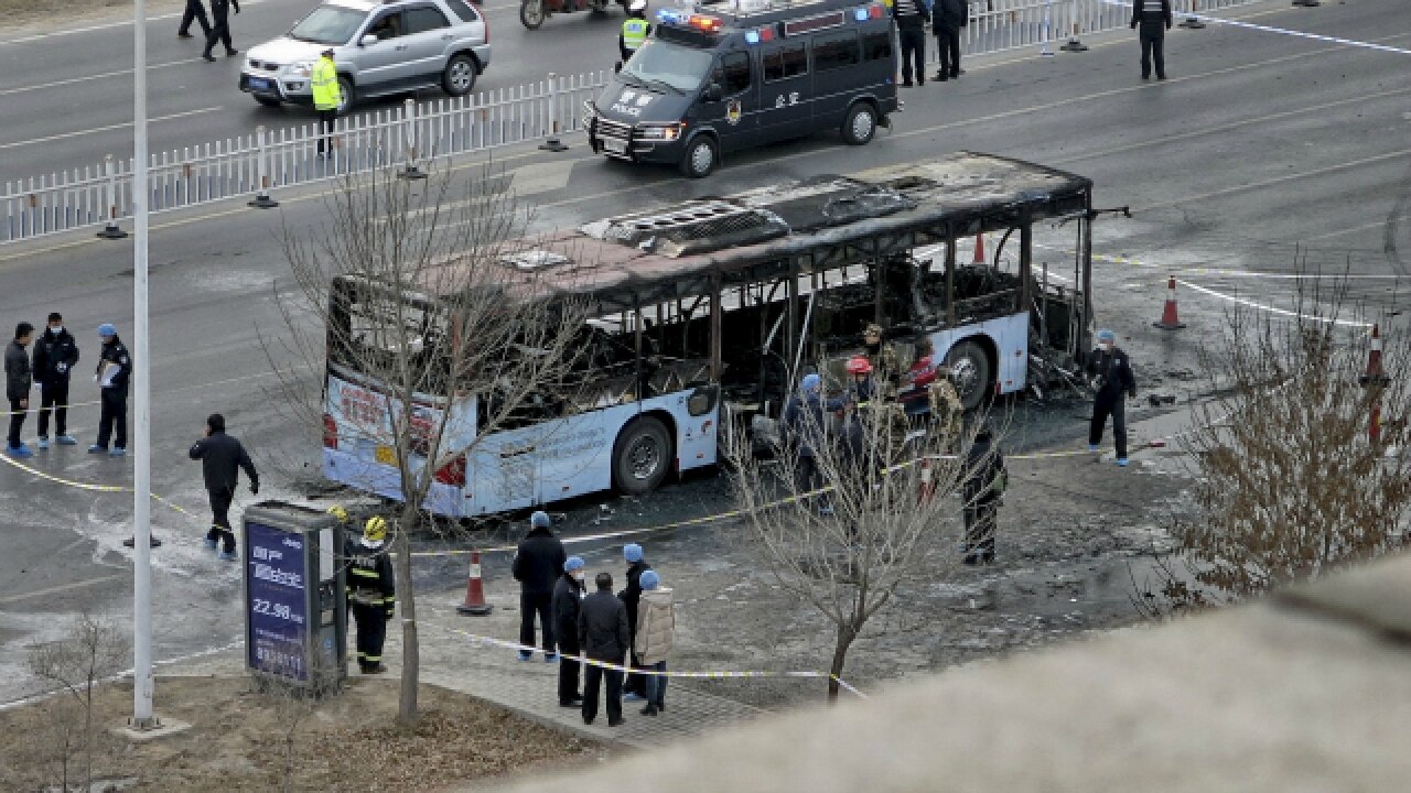 Suspected arsonist held in China after bus fire kills 17