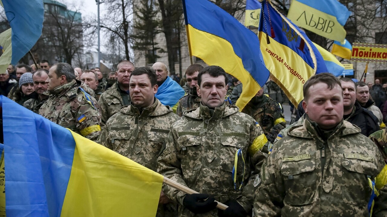 Ukrainians mark protest anniversary amid political crisis