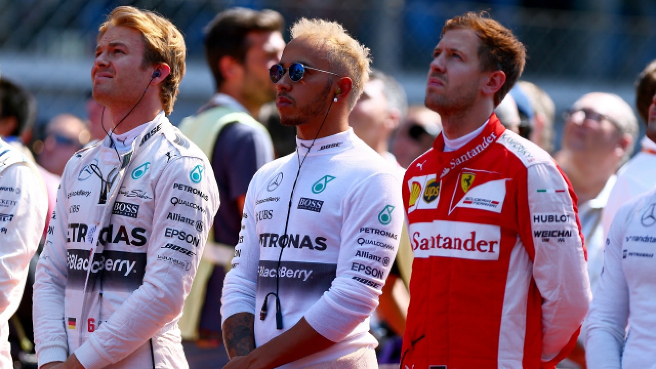 Sebastian Vettel (extreme right) with Lewis Hamilton (M) and Nico Roseberg