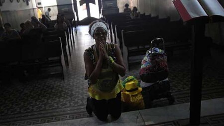 Homeless woman praying