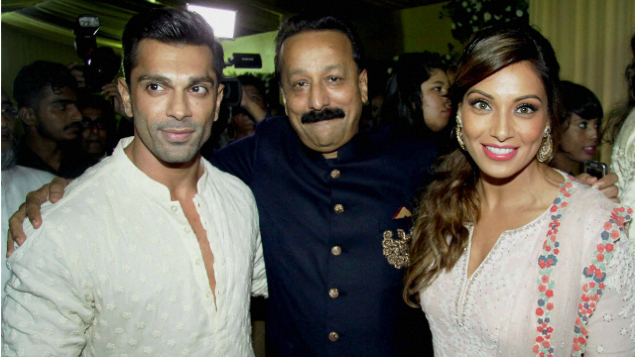 Karan Singh Grover and Bipasha Basu with Baba Siddique (C)