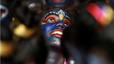 A child dressed as Lord Krishna