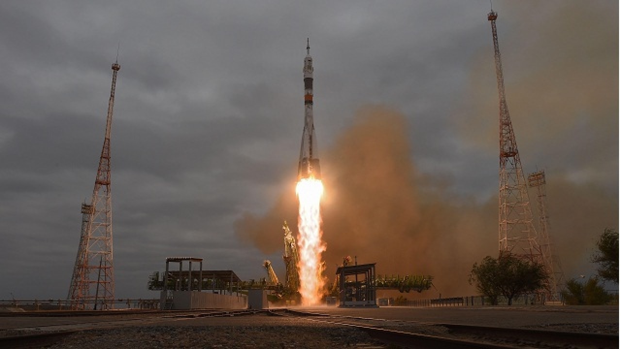 Two Russians, American blast off to International Space Station