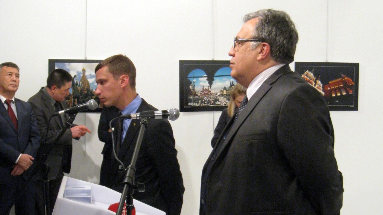 Russian envoy Andrei Karlov giving his speech