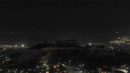 After: The hill of the Acropolis in Greece plunges into darkness