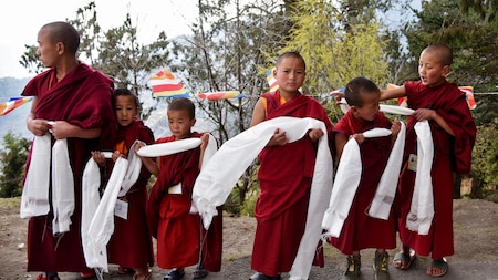 Young monks await the Dalai Lama