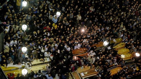 Coffins are seen in the bombed church