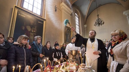 A priest blesses Easter treats