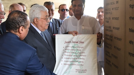 Palestine President Mahmud Abbas receives a memento