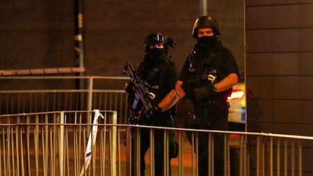 Armed police officers secure the Manchester Arena