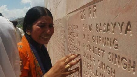 A woman breaks down seeing her brother's name up on the wall of fallen heroes Kargil War