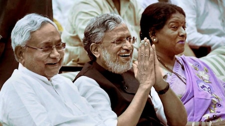 Nitish Kumar and Sushil Kumar Modi share a laugh after their swearing-in