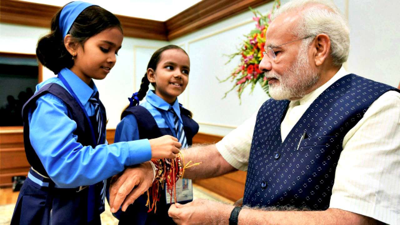 Children tying rakhis on PM Modi's wrist