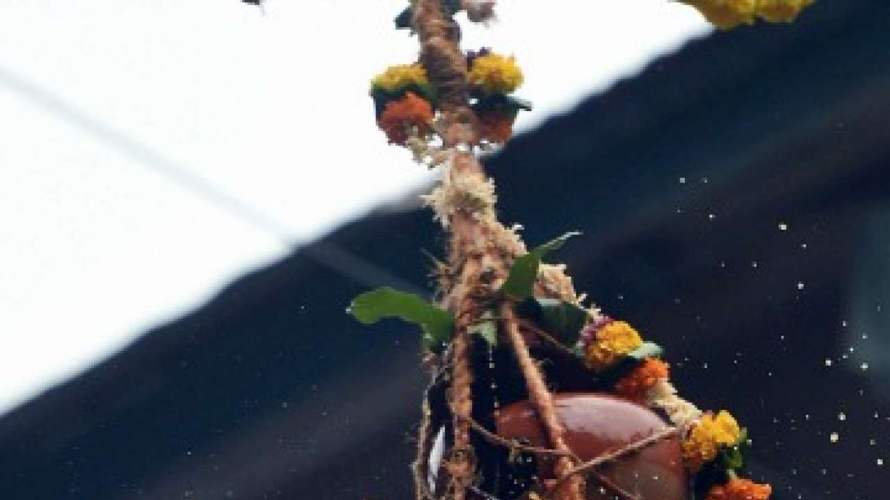 Govinda breaks a Dahi Handi during celebration of Janmashtami festival in Mumbai on Tuesday.