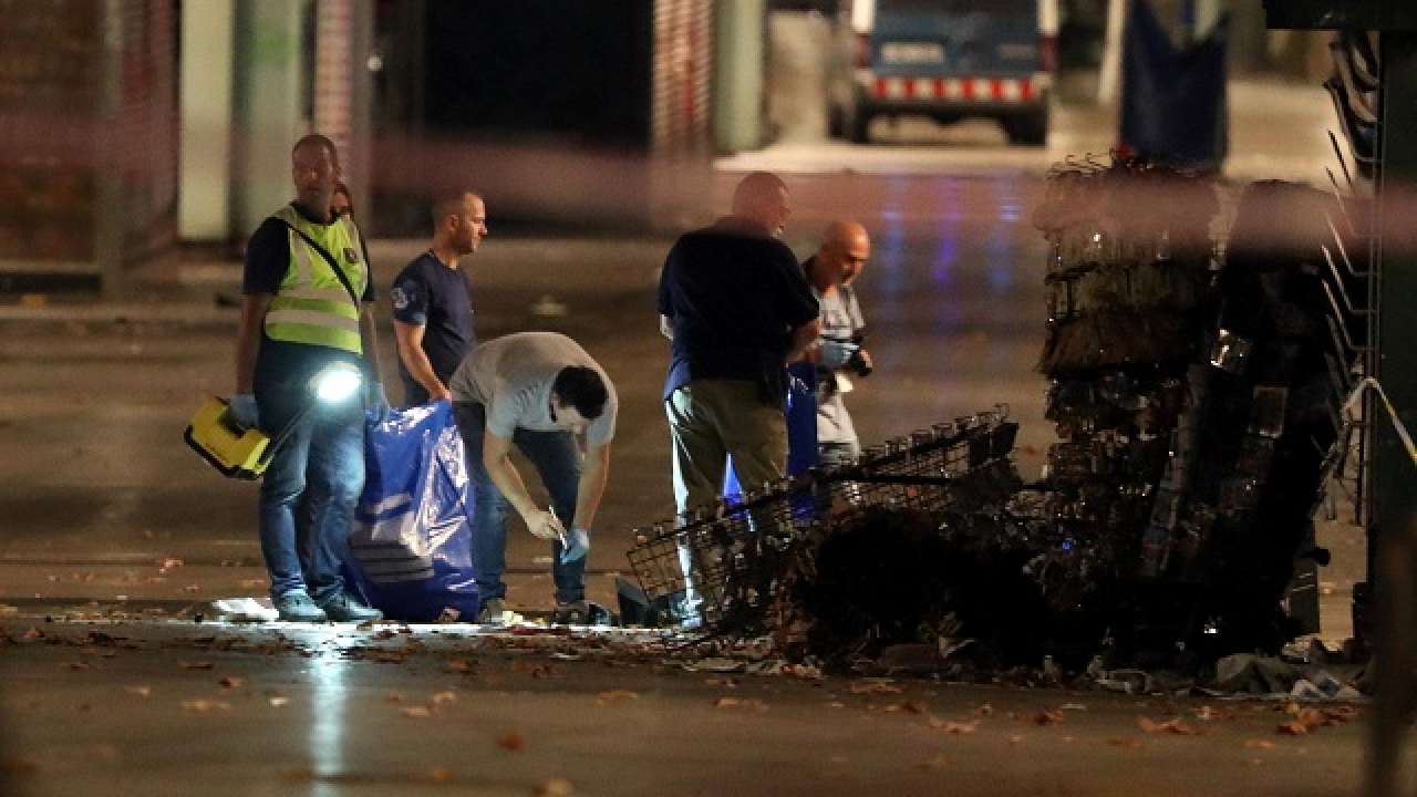Barcelona van attacker may still be alive, on the run, say police