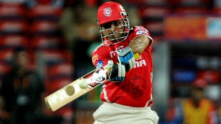 Kings XI Punjab player Virender Sehwag plays a shot during an IPL match with Delhi Daredevils in Pune, Wednesday.