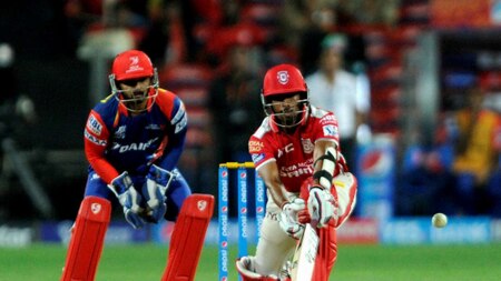 Kings XI Punjab player Wriddhiman Saha plays a shot during an IPL match with Delhi Daredevils in Pune, on Wednesday.