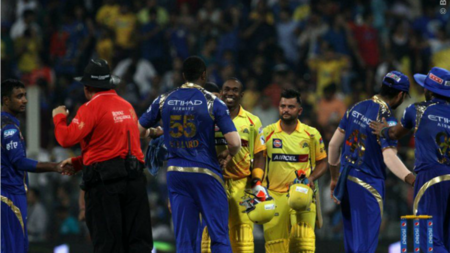 Dwayne Bravo (center-left) and Suresh Raina (center-right) shake hands with MI players post the match