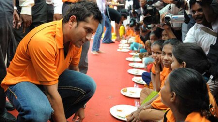 Sachin talking to some of the many children