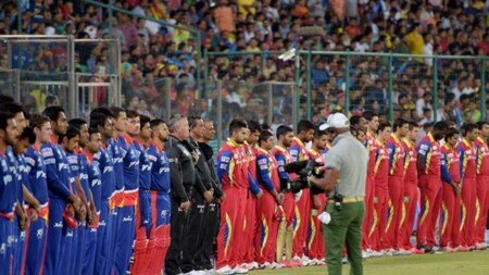 RCB and Delhi Daredevils players expressing condolence for earthquake victims in Nepal and India during their IPL-2015 match at Feroz Shah Kotla Stadium in New Delhi on Sunday.